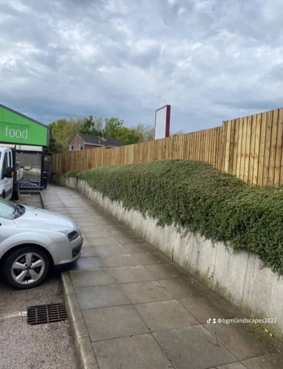 New timber garden fencing installed around a commercial property