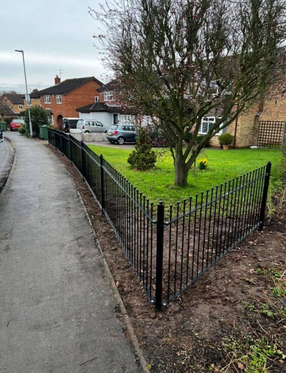 Bespoke fencing surrounding a front garden