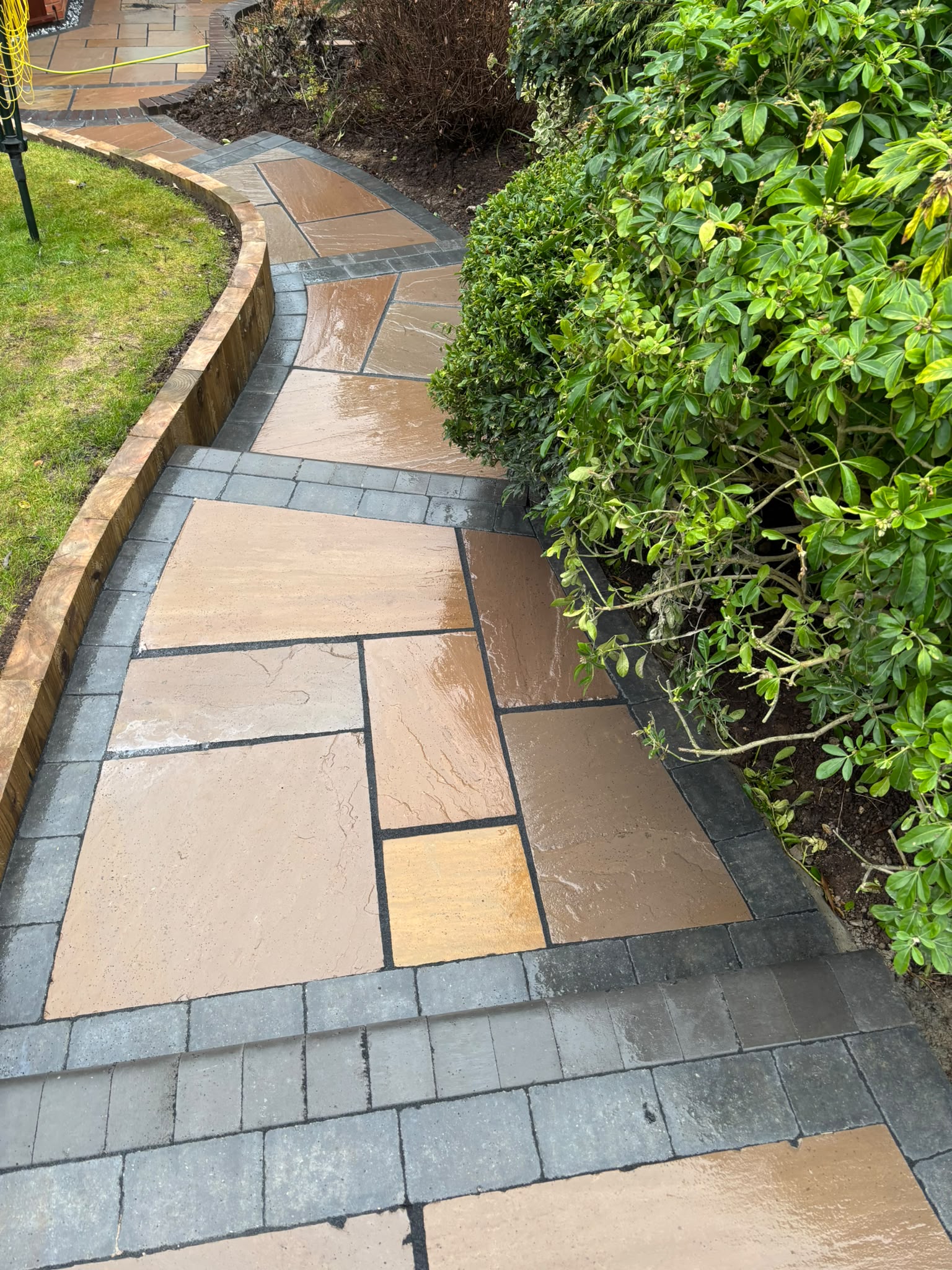 Complete rear garden transformation with paving, lawn and planting