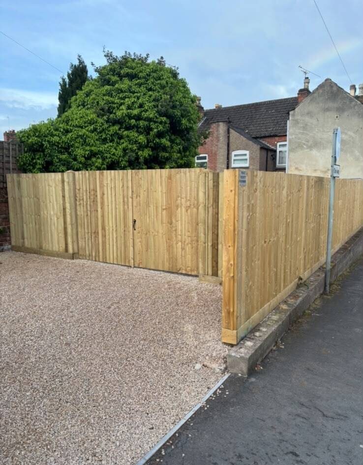 Closeboard fencing installed along a garden boundary