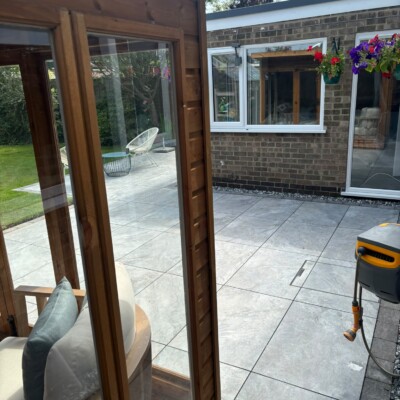 Newly installed patio paving in a landscaped back garden