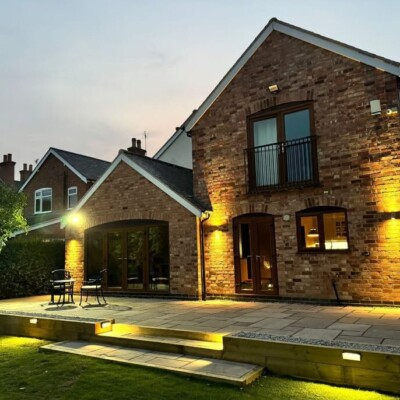 Large paved patio area in a residential garden