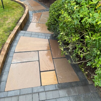 Complete rear garden transformation with paving, lawn and planting